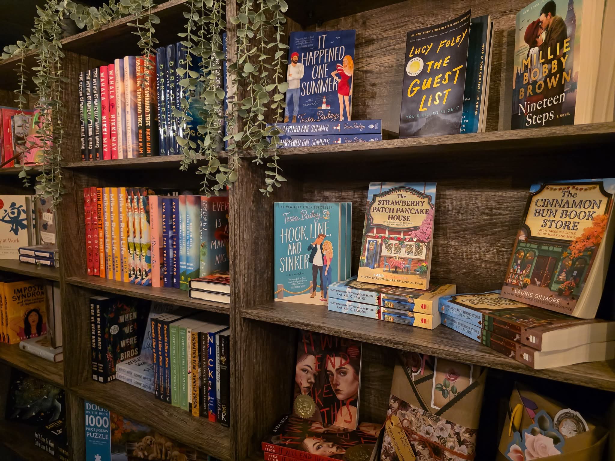 Curated bookshelf of contemporary romance and fiction — Lucy Foley, Tessa Bailey, Cinnamon Bun Bookstore, Strawberry Patch Pancake House